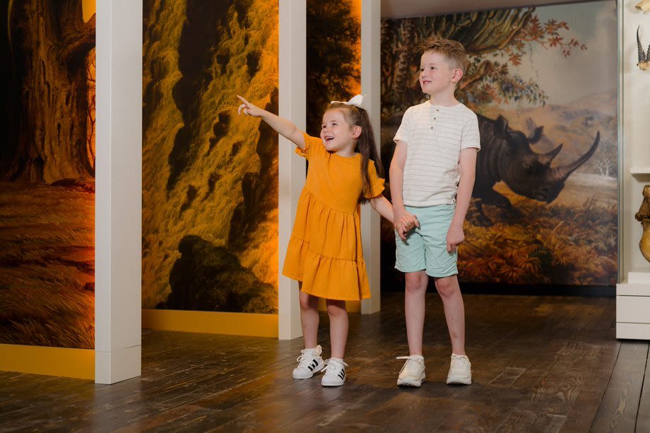 Two children exploring displays at the David Livingstone Birthplace Museum.